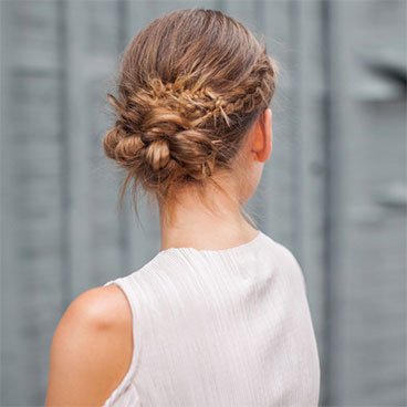 braided messy bun hairstyle